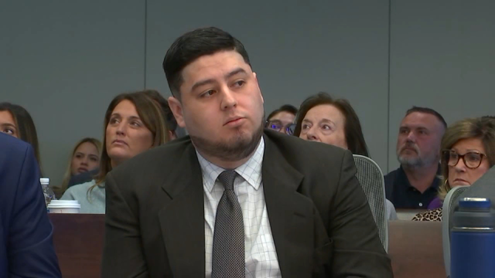 A courtroom scene reflecting the tension of a murder trial